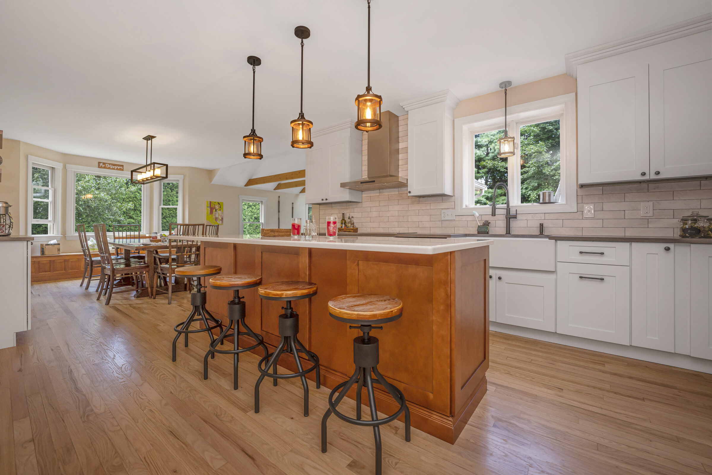 Open-plan kitchen renovation with custom island and hardwood floors