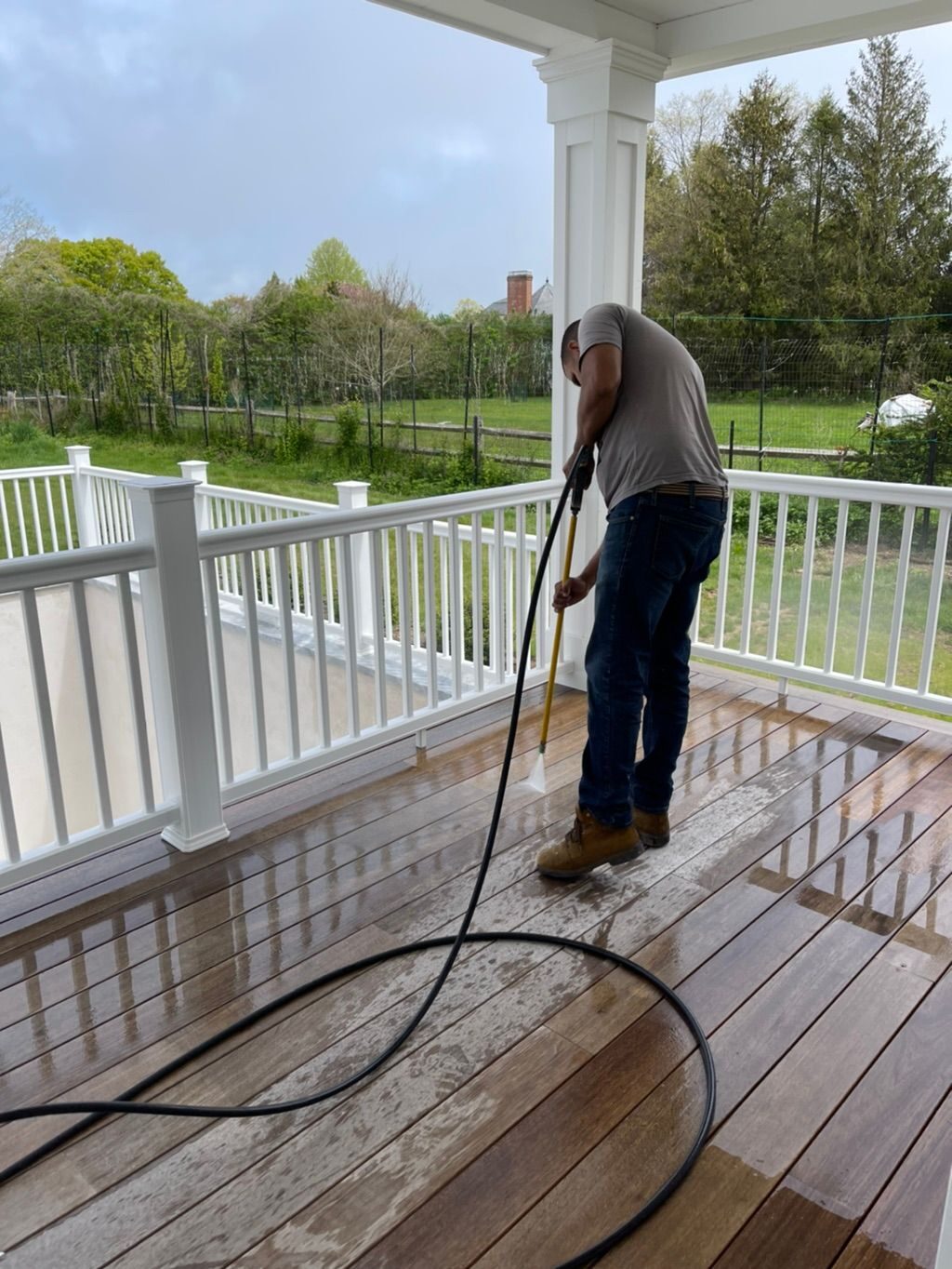 Power washing a wood deck before refinishing