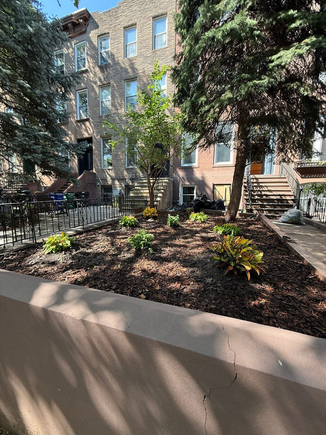 Front garden bed rebuilt with retaining wall and new planting